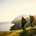 Shot of a young couple hiking through the mountains